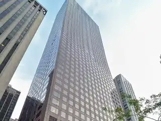 Sky-High Duplex with Floating Staircase and Lake Views