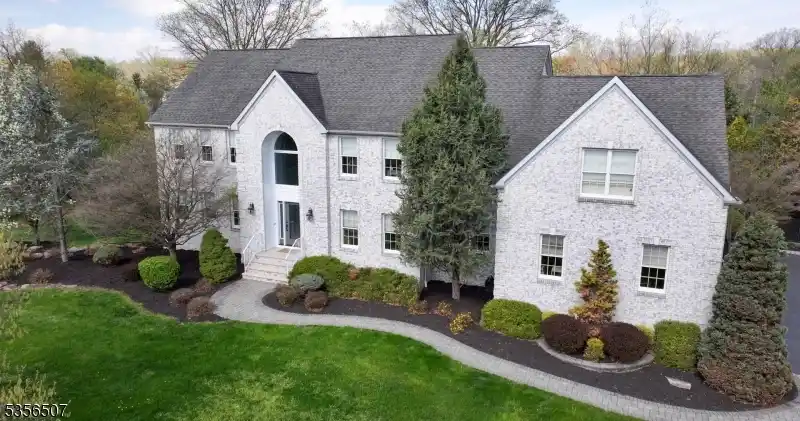 Elegant Home Boasts Grand Staircase and Pool