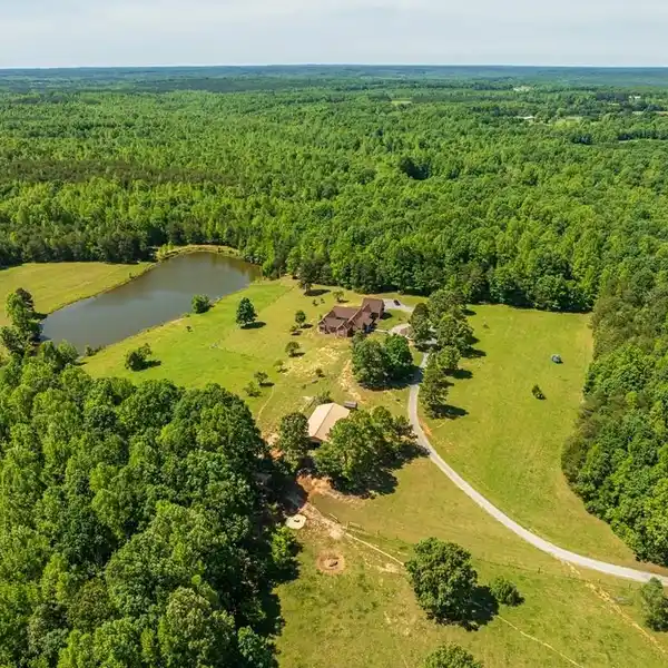 SECLUDED 62-ACRE ESTATE WITH BARN & POND