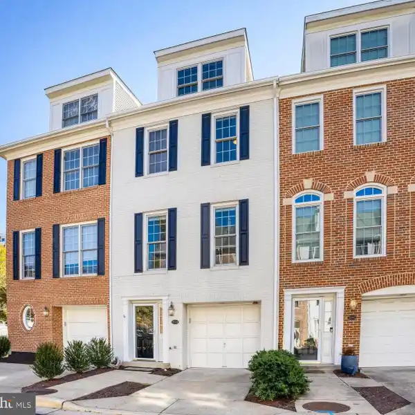 PRIVATE BRICK PATIO WITH DIRECT GARAGE ACCESS
