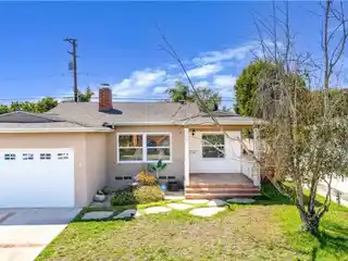 Charming Mid-Block Home with Dual Fireplaces and Modern Kitchen