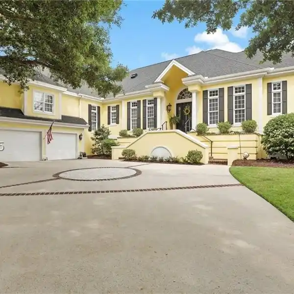 ENJOY TRANQUIL LAGOON VIEWS AND A FRONT-ROW SEAT TO THE 8TH FAIRWAY FROM THIS BEAUTIFUL WEXFORD HOME