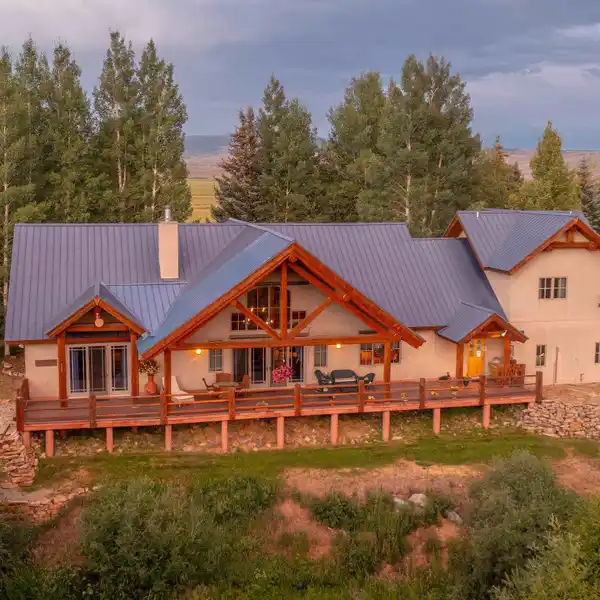 MASTERFULLY CRAFTED LOG HOME ON OVER TEN ACRES