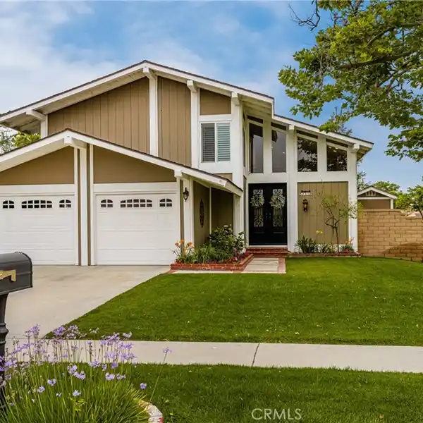 BEAUTIFULLY MAINTAINED HOME ON A PRIME CORNER LOT