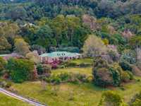 ROLLING HILLS WITH MULTIPLE COTTAGES AND SWEEPING OCEAN VIEWS