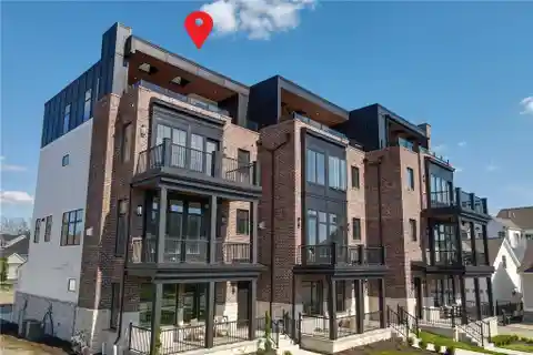 Distinctive Brownstone at the River's Edge