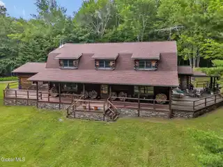 Two Unique Secluded Log Homes on 50 Acres