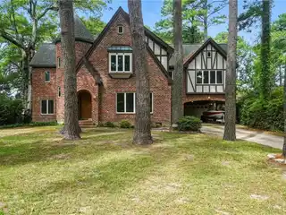 Tudor-Style Waterfront Home with Endless Potential