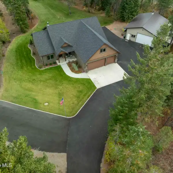 BEAUTIFUL SINGLE-LEVEL HOME ON NEARLY FIVE WOODED ACRES