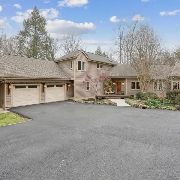 ARCHITECTURAL FOREST RETREAT ON SEVEN PRIVATE ACRES