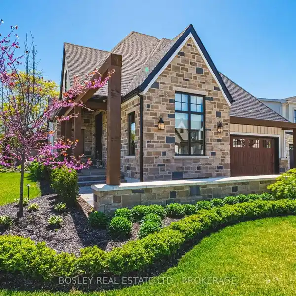CUSTOM-DESIGNED BUNGALOW WITH ELEGANT LANDSCAPING AND ARCHITECTURAL DETAIL