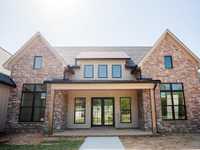 REMARKABLE NEW CONSTRUCTION IN WOODSON RIDGE