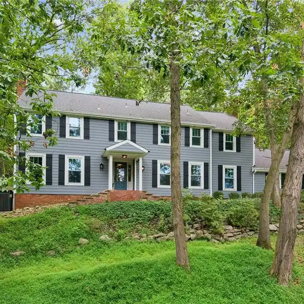 FARMHOUSE-STYLE HOME ON THREE-PLUS PRIVATE ACRES