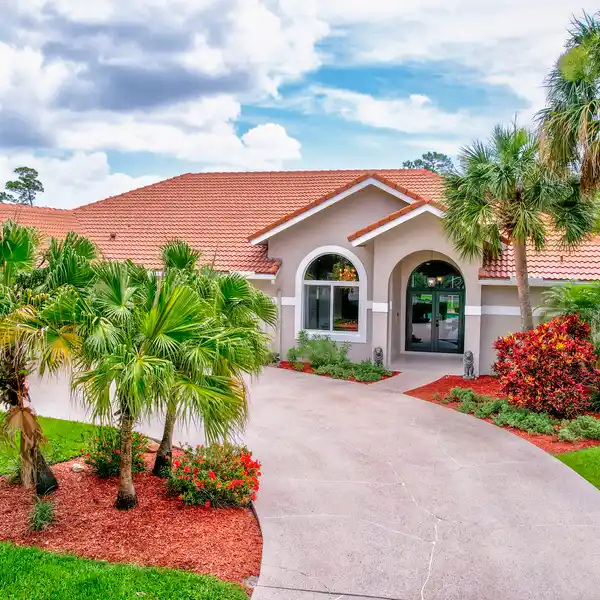 SOPHISTICATED RESIDENCE IN COVETED BANYAN LAKES