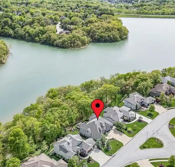 IMPECCABLE HOME ON AN EXCLUSIVE LAKE VIEW LOT
