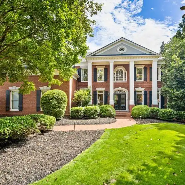 EXQUISITE WHITE COLUMNS HOME IN A PREMIER COMMUNITY