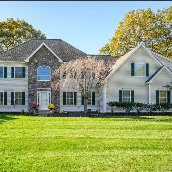LOVELY COLONIAL-STYLE RESIDENCE BOASTING CURB APPEAL