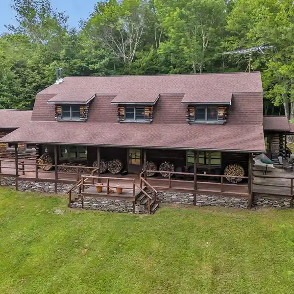 TWO UNIQUE SECLUDED LOG HOMES ON 50 ACRES