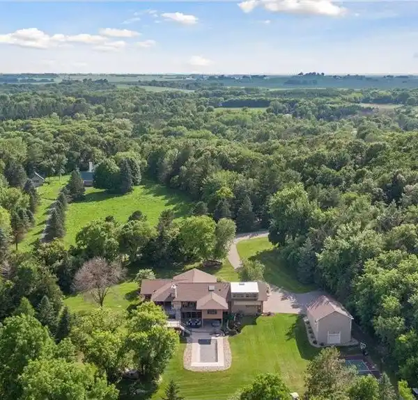 MID-CENTURY MODERN OASIS ON 5+ WOODED ACRES