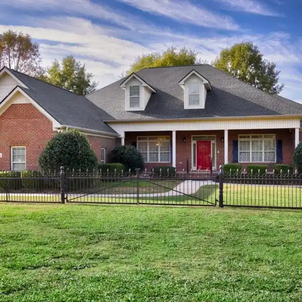 ELEGANT BRICK ESTATE WITH SERENE ACREAGE AND LUXURY TOUCHES