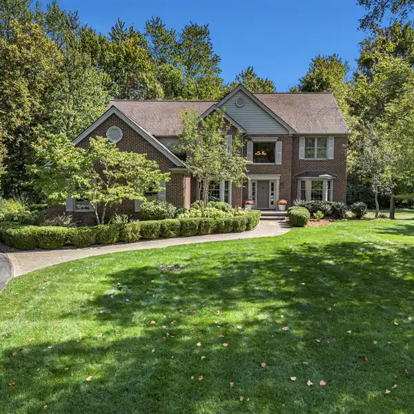 CUSTOM BUILT COLONIAL WITH THREE SEASON SUNROOM
