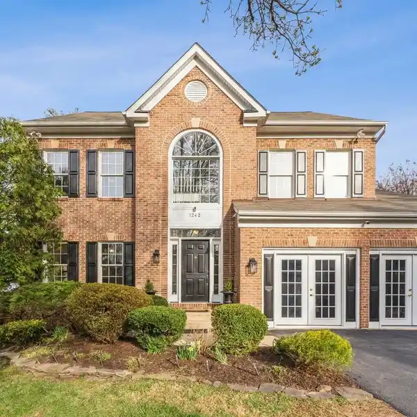 LUXE BRICK COLONIAL WITH BACKYARD PARADISE