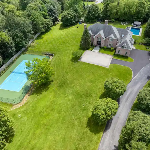 STATELY BRICK COLONIAL ON NEARLY THREE PRIVATE ACRES