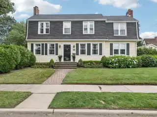 Delightful Colonial Home Nestled on Prime Corner Lot