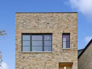 Custom Brick Beauty with Luxe Finishes Throughout