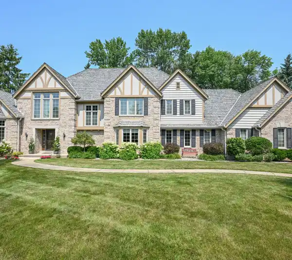 EXQUISITE TUDOR ON A SPACIOUS CORNER LOT
