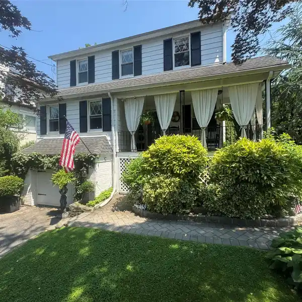 SUNNY COLONIAL RETREAT WITH BEAUTIFUL BLOOMING GARDENS