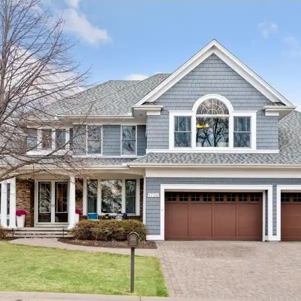 STRIKING TWO-STORY HOME IN HIDDEN LAKES