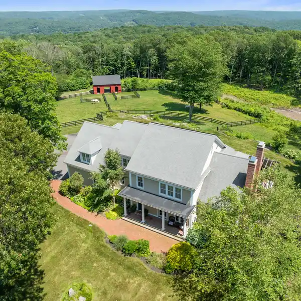 REFINED FARMHOUSE RETREAT ON 10+ ACRES