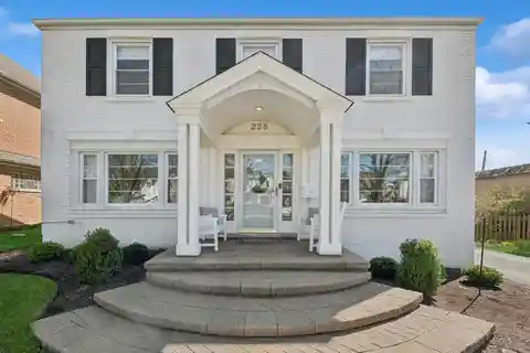 Stunningly Updated White Painted Brick Colonial