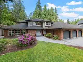 Elegant Estate with Serene Creekside Backyard