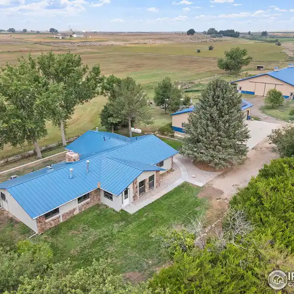 CUSTOM RANCH HOME WITH LARGE DETACHED GARAGE AND BARN ON 40 ACRES