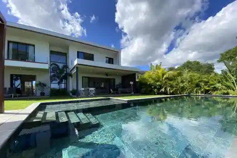 Modern Riverfront Villa with Infinity Pool & Sea Views