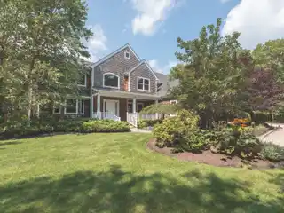 Refined Quogue Retreat with Tennis and Poolside Luxury