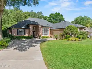 Elegant Brick Home with Tranquil Water Views