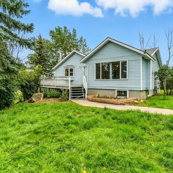 SOLIDLY BUILT 1960’S WALK-OUT BUNGALOW