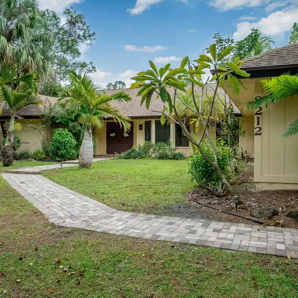 RARE CANAL-FRONT FIND IN PALM BEACH COUNTRY ESTATES