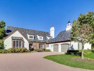 Grand Two-Story Family Room with Limestone Fireplace