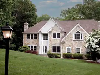 Elevated Elegance in Distinguished Wooded Enclave