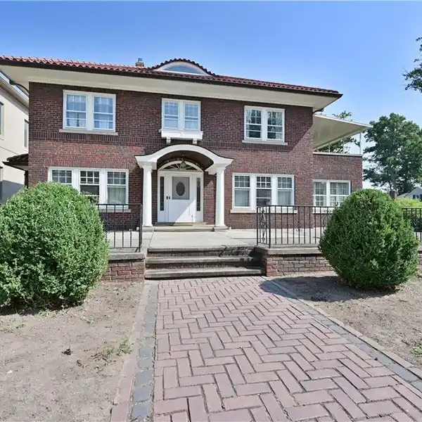 CHARMING BRICK LAKEFRONT HOME ON EXPANSIVE LOT