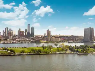 Exquisite Riverfront Apartment with Skyline Views