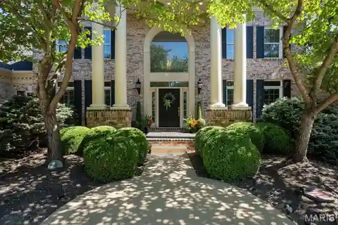 Grand Residence with Sunlit Architectural Drama