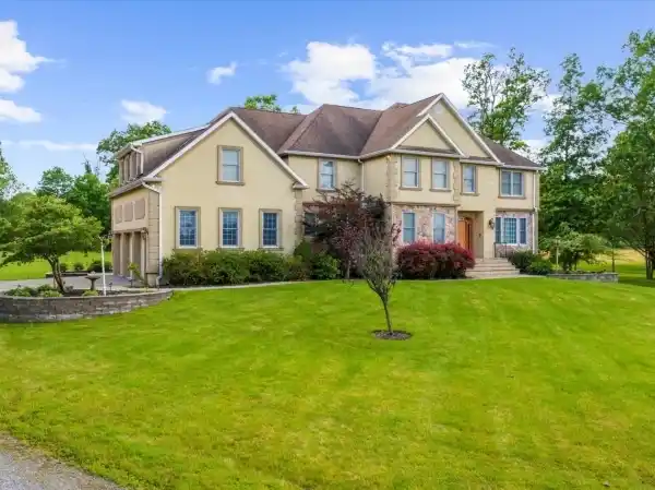 PRISTINE CUSTOM COLONIAL HOME ON 18.8 ACRES