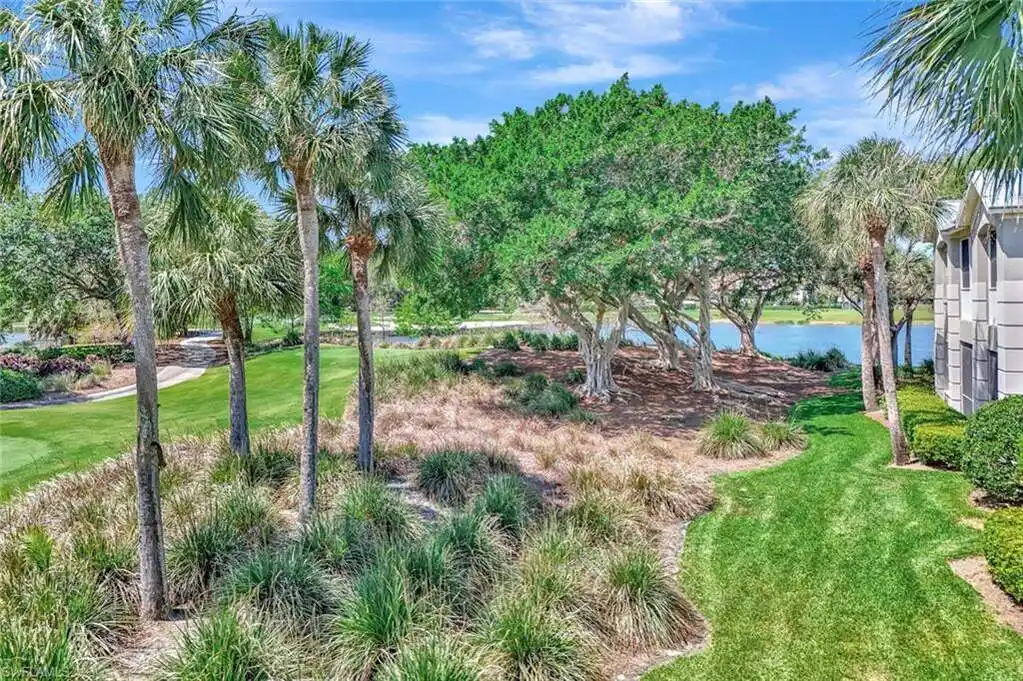 Upper-floor End Unit with Panoramic Golf and Water Views