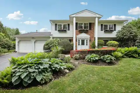 Classic Colonial Retreat with Lush Outdoor Oasis