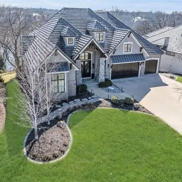 IMPECCABLE HOME ON AN EXCLUSIVE LAKE VIEW LOT